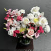 Gorgeous mix of orchids, roses and mums in light pink colors. 