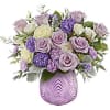 Whimsically enchanting, this lovely bouquet of lavender and light yellow blooms is