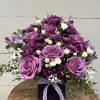 This monochromatic purple arrangement is perfect for any event ranging from a