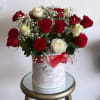 red and white roses in a suede box.