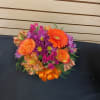 Mixed cut arrangement with orange alstroemeria, gerbera daisy, purple daisies, high &amp;