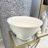  A large, sleek white decorative bowl, perfect for enhancing elegant home