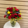 Small mixed cut with red roses, red mini carnations, yellow billy bob