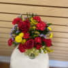 Small mixed cut with red roses, red mini carnations, yellow billy bob