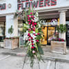 A standings flower arrangement for a funeral service is a heartfelt tribute