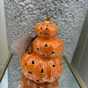  A beautiful small pumpkin tower in vibrant orange hues, capturing the