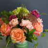 We will put together a lush arrangement in a lovely color palette