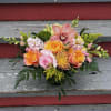 We will put together a lush arrangement in a lovely color palette