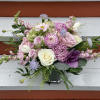 We will put together a lush arrangement in a lovely color palette