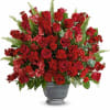 A bold expression of your deepest condolences, this elegant mix of red