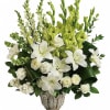 Peaceful and majestic in a large antiqued pot, this wondrous white arrangement