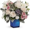 Add enchantment to their everyday with creamy roses and moody greens, artfully