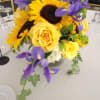 Mixed flowers artfully designed in a vase