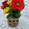 Ceramic lantern with red roses, yellow daisys, orange gerbera, hypericum berries and