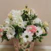 A summer arrangement with pale yellows, lavender and whites.  All in