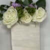 A pocket boutonniere is a charming and innovative floral accessory designed to
