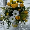 Yellow spray roses, white daisys, yellow chrysanthemums, solidago and white monte arranged