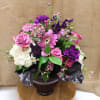 Fuschia vase filled with hydrangea, , roses, daisies, lisianthus, and more.
comes in