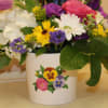 spring arrangement in a pansy ceramic container 