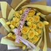 20 yellow roses with 10 yellow tulips in a ramo buchon wrapped