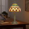 This tiffany style-stained glass lamp features the family chain going around the