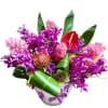 
The Tropical Bouquet is a stunning arrangement that embodies the beauty of