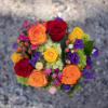 A vibrant mix of high end garden flowers suitable for a celebration