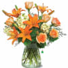 What&rsquo;s pretty in peach? This rich mix of orange lilies, peach roses
