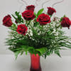 Beautiful one dozen Red Roses surrounded by lush greenery and baby&#039;s breath