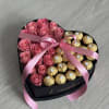 a heart box half roses and half chocolate