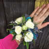 A beautiful white corsage made with your choice of flowers. 
Options include: