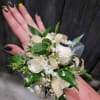 A beautiful white corsage made with your choice of flowers. 
Options include: