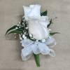 A beautiful corsage with two roses, perfect for prom a wedding or