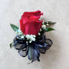A beautiful corsage with two roses, perfect for prom a wedding or