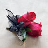 A beautiful corsage with two roses, perfect for prom a wedding or