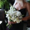 Adele is a beautiful bridal bouquet featuring a mix of fresh white