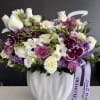 Purple and white roses together symbolize a blend of enchantment, elegance, and