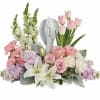 Show them you care with this gorgeous display of roses, lilies and