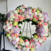 A Large Spray arrangement with a variety of flowers in all pastel
