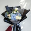 Clouds of Hope Wrapped Bouquet includes hydrangea, roses and other fresh flowers.

Our