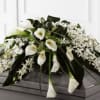 White Dendrobium orchids, white calla lilies, green hydrangea and a variety of