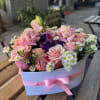 A heart of pink flowers is a delicate and elegant composition, full