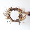 Bring warmth and charm to your space with this stunning Sunset Wreath.