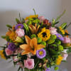 Luxurious and lasting arrangement consisting of a grand gathering of roses, lilies