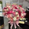 Stunning large hat box with the freshest blooms of roses, pink light