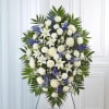 Standing spray arrangement with white roses, Asiatic lilies, football mums, carnations and