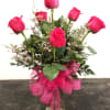 Surprise someone special with half a dozen stunning long-stemmed roses elegantly arranged