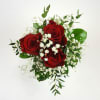 A striking petite prom bouquet, featuring red roses embraced by delicate clouds
