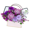 The Love Blooms Here Tote is a beautifully crafted arrangement, showcasing our