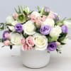 Pink roses with lisianthus, waxflower and stock flowers make this a chic